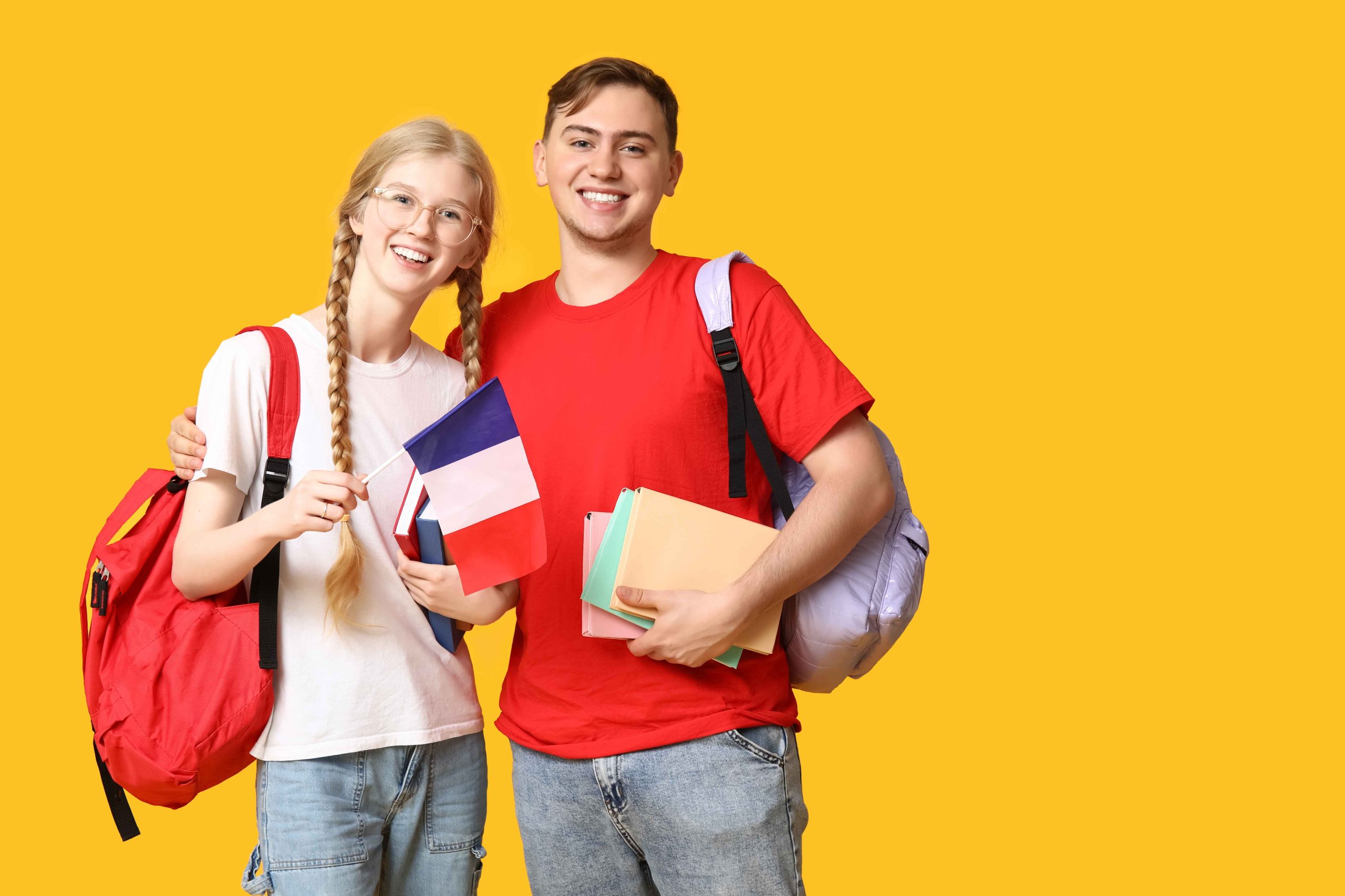 Students,With,French,Flag,On,Yellow,Background